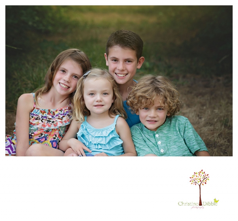 Sonora family photographer Christine Dibble Photography takes portraits of cousins sitting together at Indigeny among the trees.