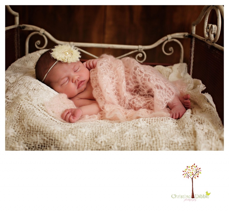 Newborn photography by Sonora photographer Christine Dibble Photography includes studio sessions with posed and prop images with tiny little iron beds.