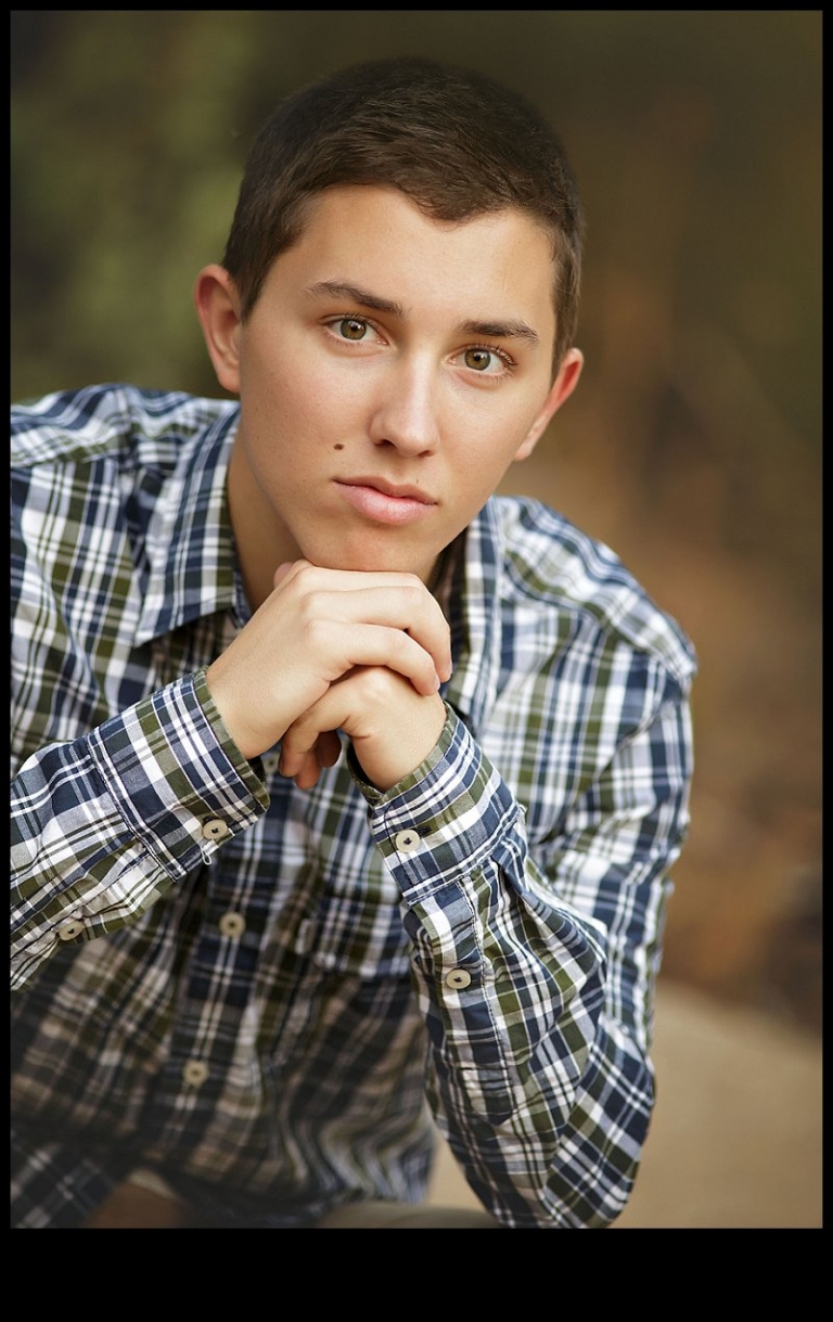 Christine Dibble takes a head shot portrait of a senior boy from Summerville High School during a senior portrait session with Christine Dibble Photography of Sonora.