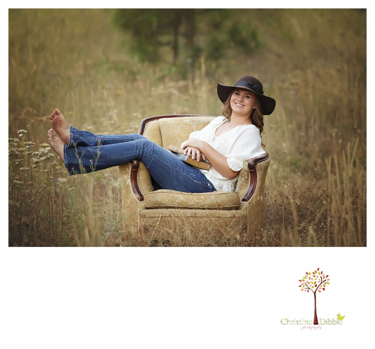 Senior portraits in Sonora taken of a Summerville Class of 2016 senior by Christine Dibble Photography captures a girl in an antique gold brocade chair in a field.