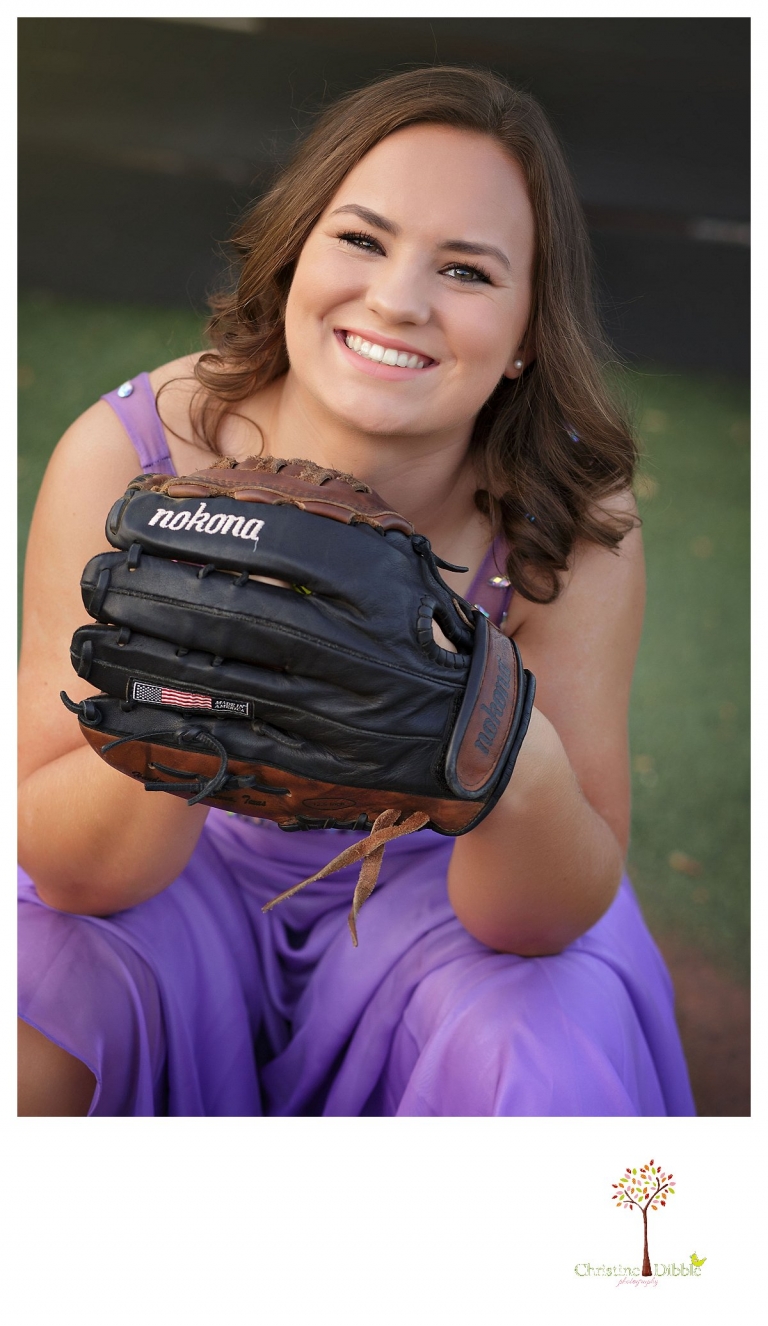 Summerville and Sonora senior portrait photographer Christine Dibble Photoraphy takes portraits of a softball player in a formal gown with her glove.