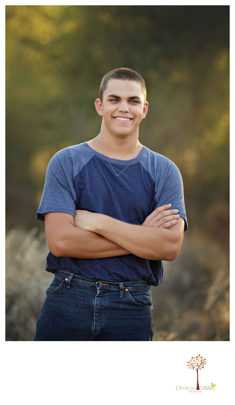 Summerville senior portrait photographer, Christine Dibble Photography of Sonora, takes photos of a senior boy laughing at Knights Ferry.