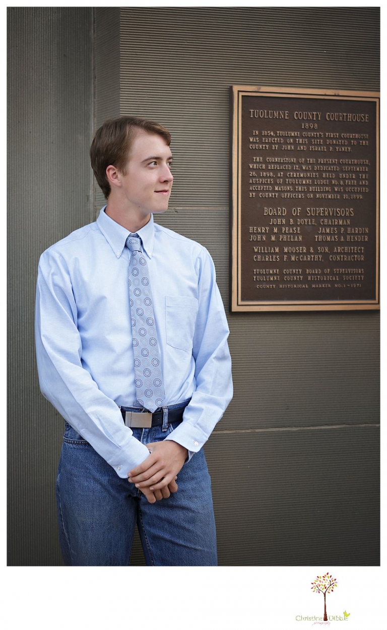 Summerville High senior portrait photographer Christine Dibble Photography takes outdoor senior portraits outside on the steps of the historic Sonora courthouse by the Tuolumne County Courthouse sign.