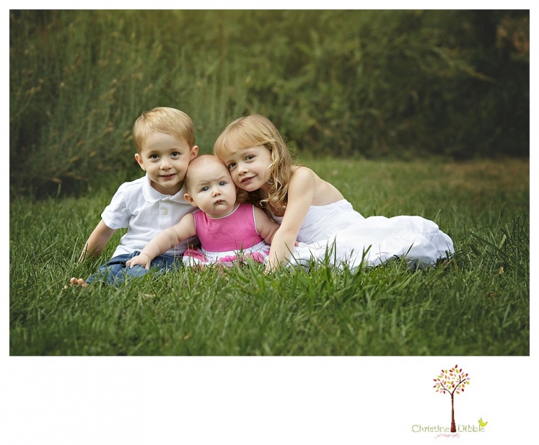 Sonora family photographer Christine Dibble Photography takes child sibling photos at a family portrait session at Twain Harte Tree Farm.
