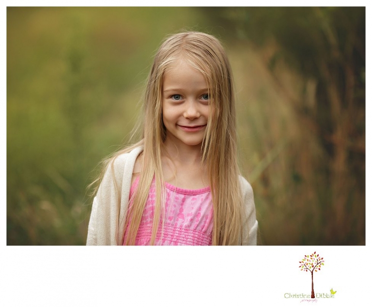 Sonora family portrait photographer Christine Dibble Photography takes family photos on a rainy day at Indigeny Reserve as a family plays in the orchards and corn field.