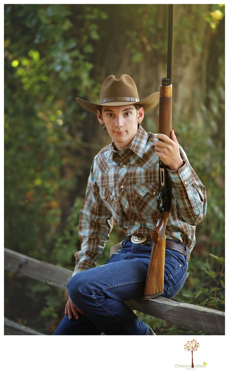 Summerville High and Sonora senior portrait photographer Christine Dibble Photography takes outdoor senior portraits of a cowboy with his trap shooting gun.