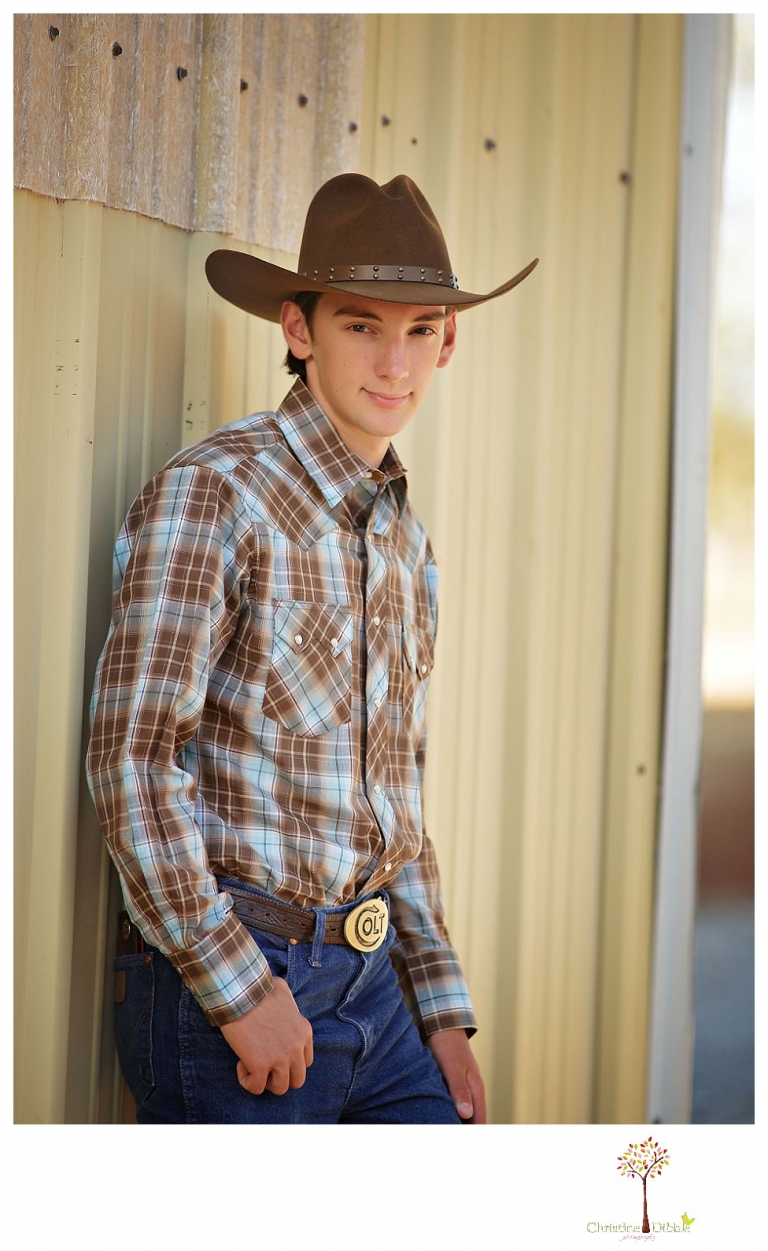 Summerville High and Sonora senior portrait photographer Christine Dibble Photography takes outdoor senior portraits of a cowboy at the ag farm on campus.