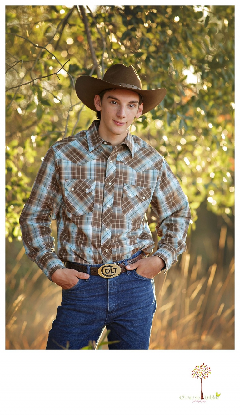 Summerville High and Sonora senior portrait photographer Christine Dibble Photography takes outdoor senior portraits of a cowboy in his dress hat and shirt with backlight.