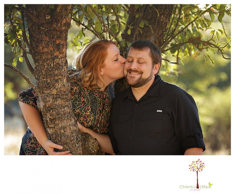Sonora engagement and couple's portrait photographer Christine Dibble Photography takes photos of couples laughing, kissing, cuddling and having fun outdoors in golden sunlight.