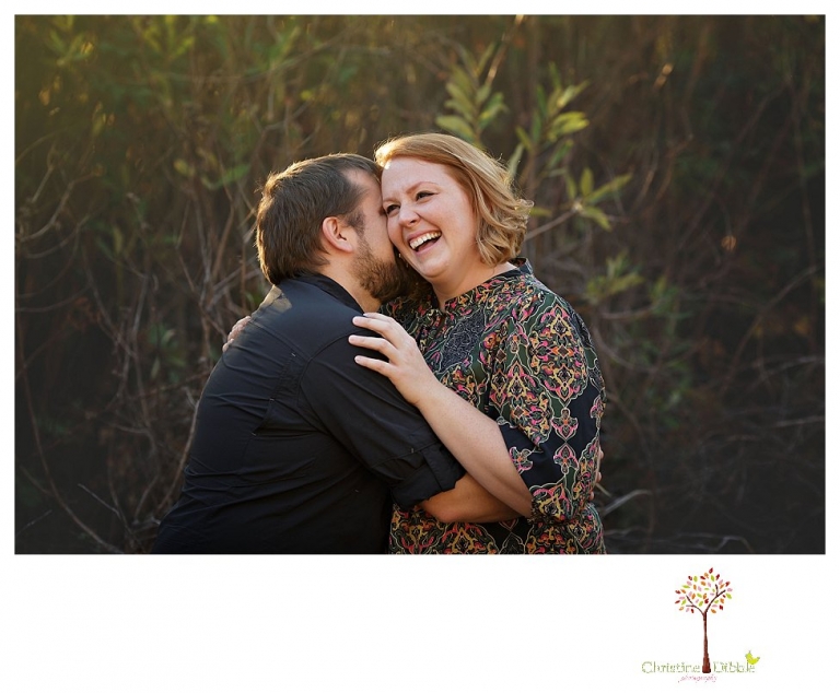 Sonora engagement and couple's portrait photographer Christine Dibble Photography takes photos of couples laughing, kissing, cuddling and having fun outdoors in golden sunlight.