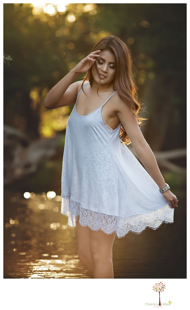 Sonora senior portrait photographer Christine Dibble Photography takes senior portraits of a beautiful Gustine High School Class of 2016 senior in a little dress as she wades in the water at Knights Ferry.