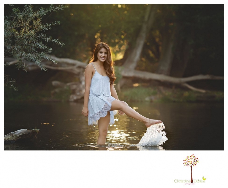 Sonora senior portrait photographer Christine Dibble Photography takes senior portraits of a beautiful Gustine High School Class of 2016 senior at Knights Ferry in the river and backlit by golden sunset light.