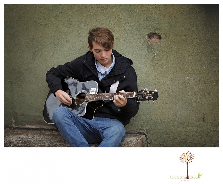 Sonora High senior portrait photographer Christine Dibble Photography photographs a senior boy in downtown Sonora with his guitar and in his Golden Regiment Band drum major uniform.