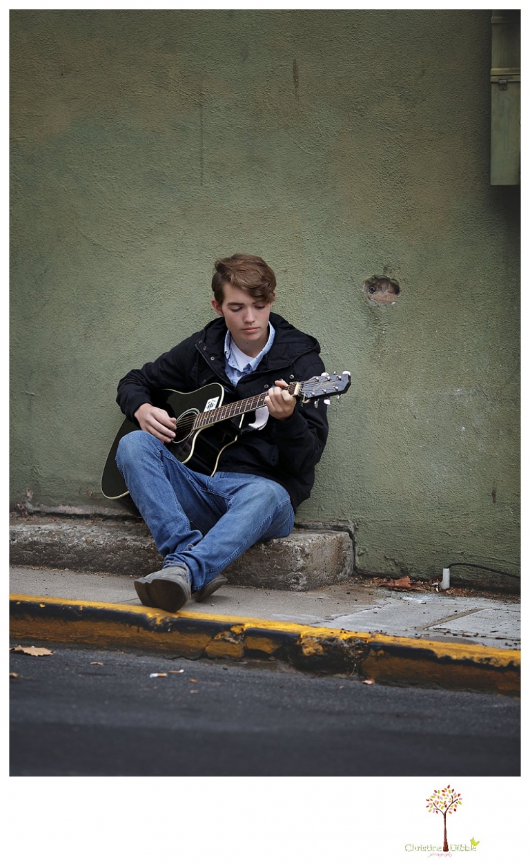 Sonora High senior portrait photographer Christine Dibble Photography photographs a senior boy in downtown Sonora with his guitar and in his Golden Regiment Band drum major uniform.