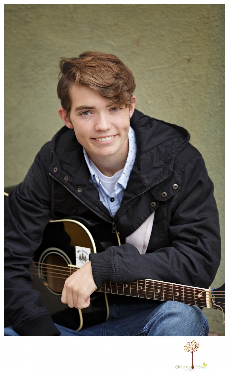Sonora High senior portrait photographer Christine Dibble Photography photographs a senior boy in downtown Sonora with his guitar and in his Golden Regiment Band drum major uniform.