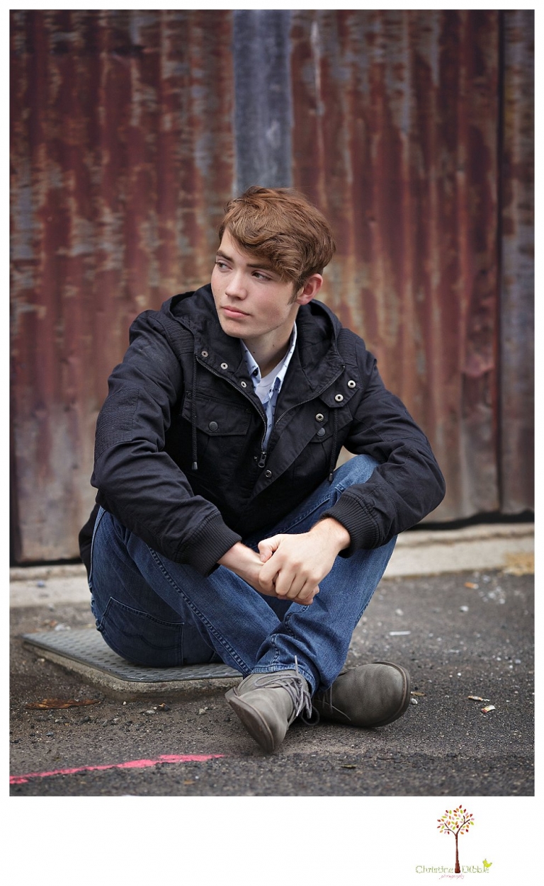 Sonora High senior portrait photographer Christine Dibble Photography photographs a senior boy in downtown Sonora with his guitar and in his Golden Regiment Band drum major uniform.
