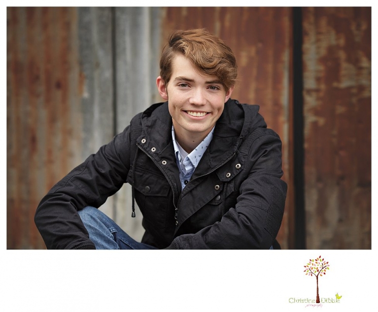 Sonora High senior portrait photographer Christine Dibble Photography photographs a senior boy in downtown Sonora with his guitar and in his Golden Regiment Band drum major uniform.