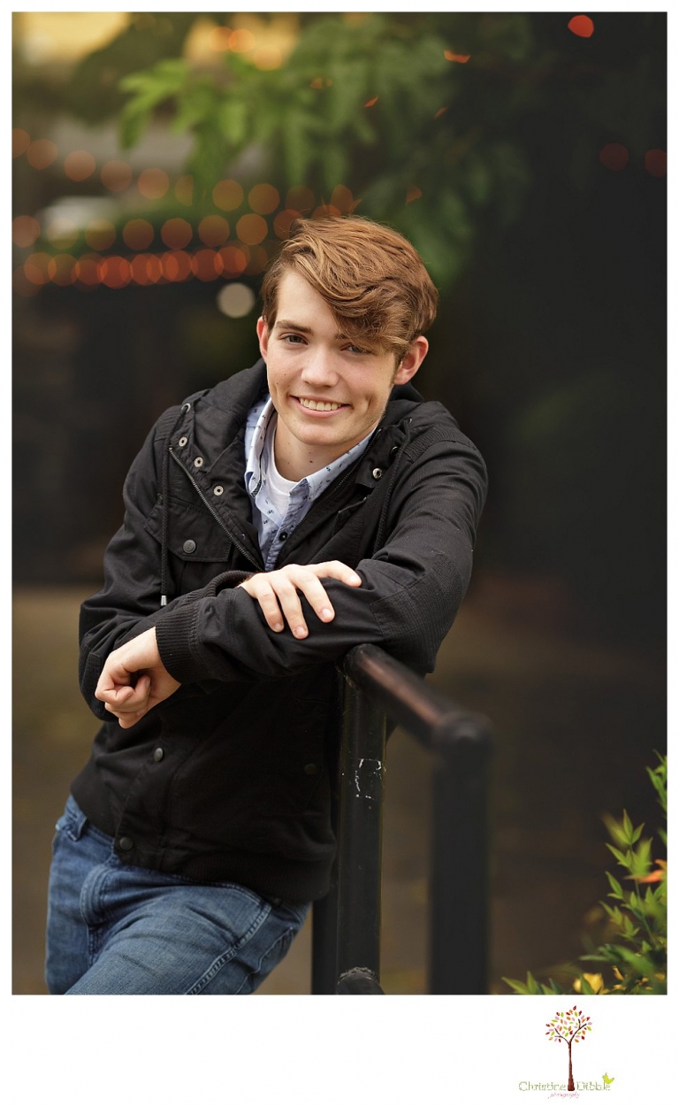 Sonora High senior portrait photographer Christine Dibble Photography photographs a senior boy in downtown Sonora with his guitar and in his Golden Regiment Band drum major uniform.