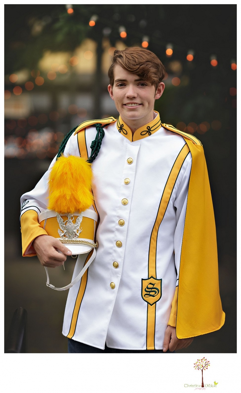 Sonora High senior portrait photographer Christine Dibble Photography photographs a senior boy in downtown Sonora with his guitar and in his Golden Regiment Band drum major uniform.