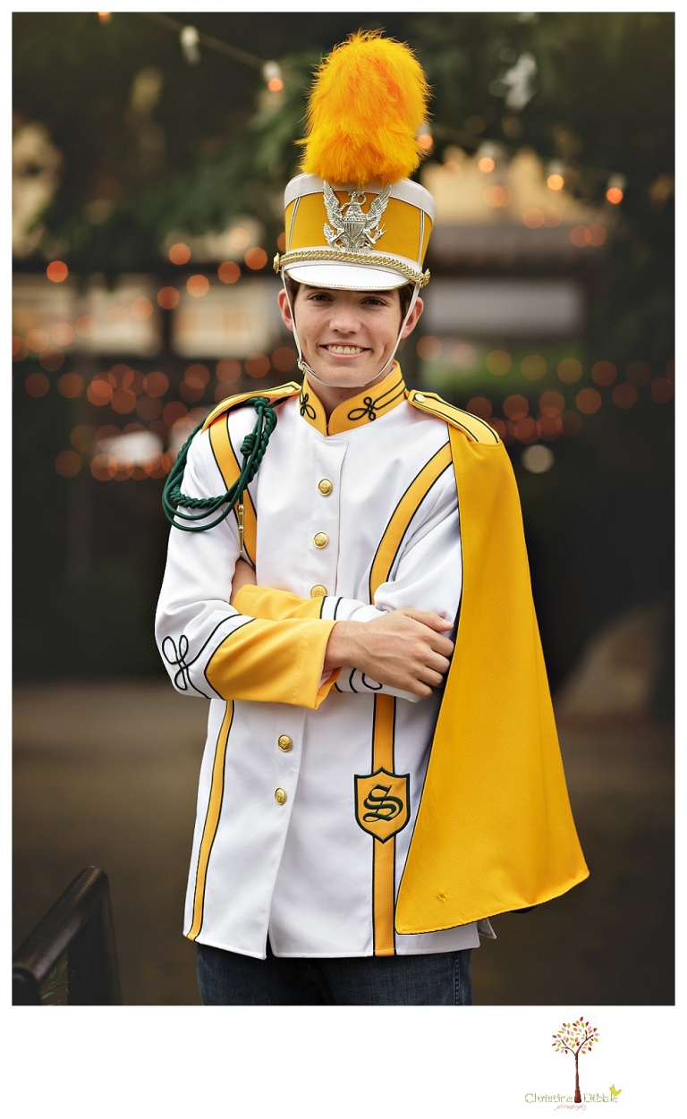 Sonora High senior portrait photographer Christine Dibble Photography photographs a senior boy in downtown Sonora with his guitar and in his Golden Regiment Band drum major uniform.