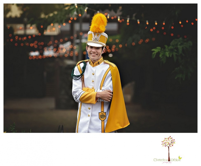 Sonora High senior portrait photographer Christine Dibble Photography photographs a senior boy in downtown Sonora with his guitar and in his Golden Regiment Band drum major uniform.