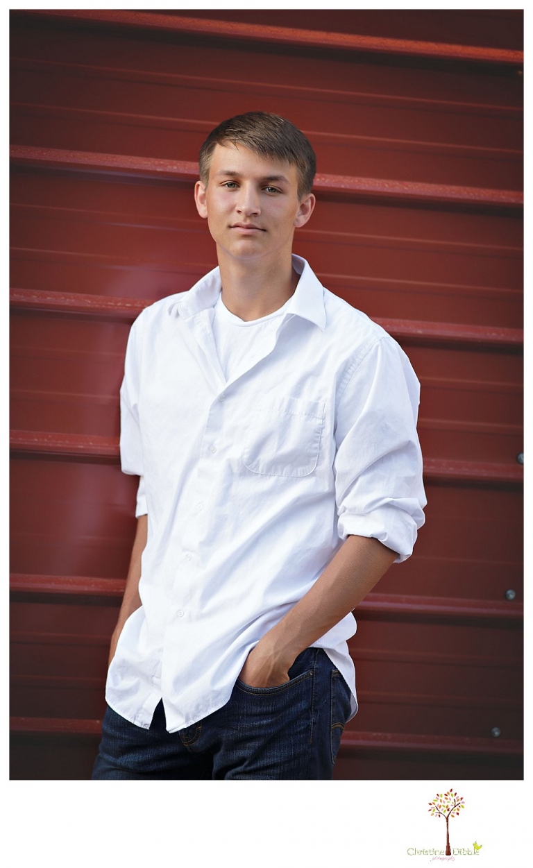Summerville senior portrait photographer, Christine Dibble Photography of Sonora takes senior portraits of a senior boy in casual and dress clothes and in his soccer uniform on the Summerville soccer field.