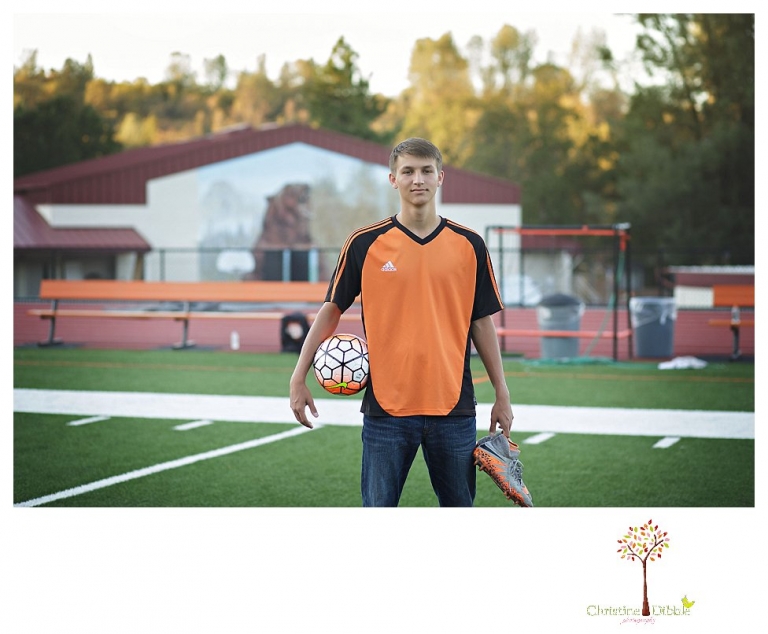 Summerville senior portrait photographer, Christine Dibble Photography of Sonora takes senior portraits of a senior boy in casual and dress clothes and in his soccer uniform on the Summerville soccer field.