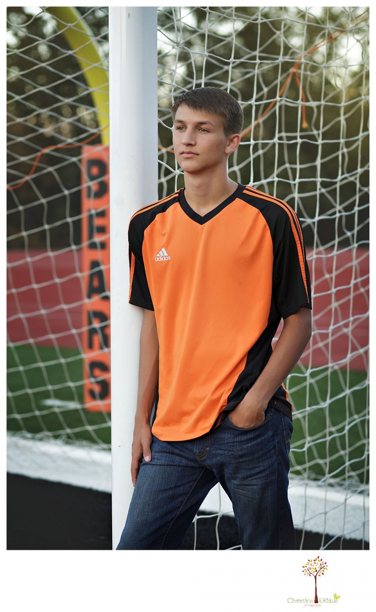Summerville senior portrait photographer, Christine Dibble Photography of Sonora takes senior portraits of a senior boy in casual and dress clothes and in his soccer uniform on the Summerville soccer field.