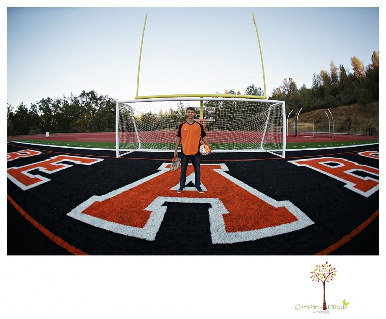 Summerville senior portrait photographer, Christine Dibble Photography of Sonora takes senior portraits of a senior boy in casual and dress clothes and in his soccer uniform on the Summerville soccer field.