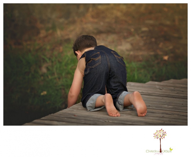 Sonora family photographer Christine Dibble Photography takes family portraits in Angels Camp of a family with three boys on private property with olive trees and a pond.