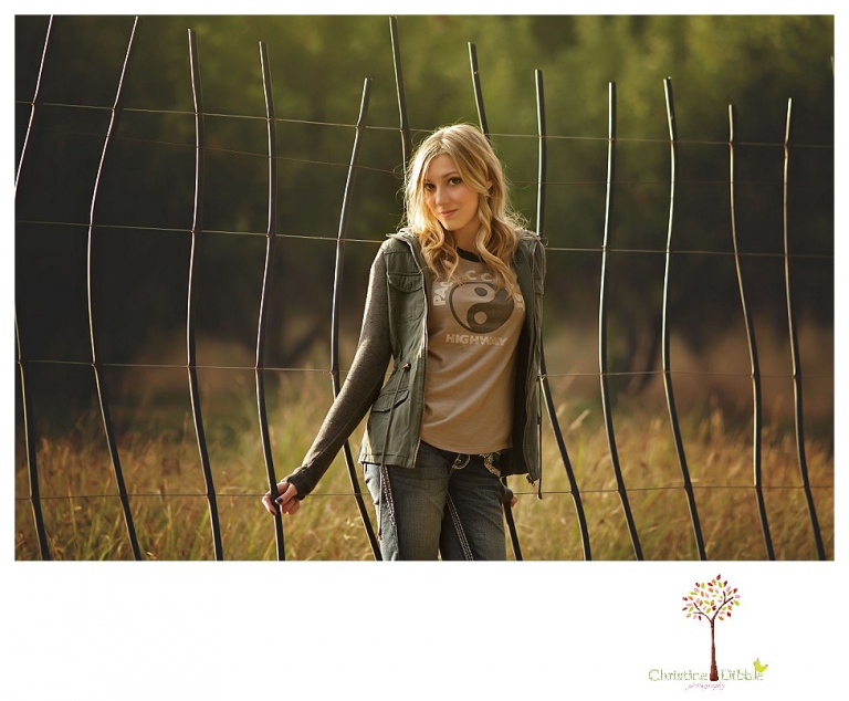 Sonora photographer Christine Dibble Photography takes Summerville senior portraits of a senior girl in the fall outside at Indigeny Reserve.
