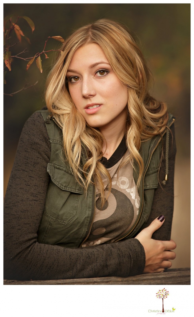 Sonora photographer Christine Dibble Photography takes Summerville senior portraits of a senior girl in the fall outside at Indigeny Reserve.