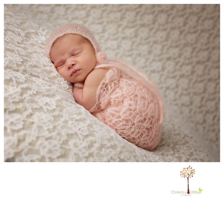 Best Sonora Newborn Photographer Christine Dibble Photography takes portraits of a sleeping newborn on blankets, in wraps and props, and on her mother's wedding dress.