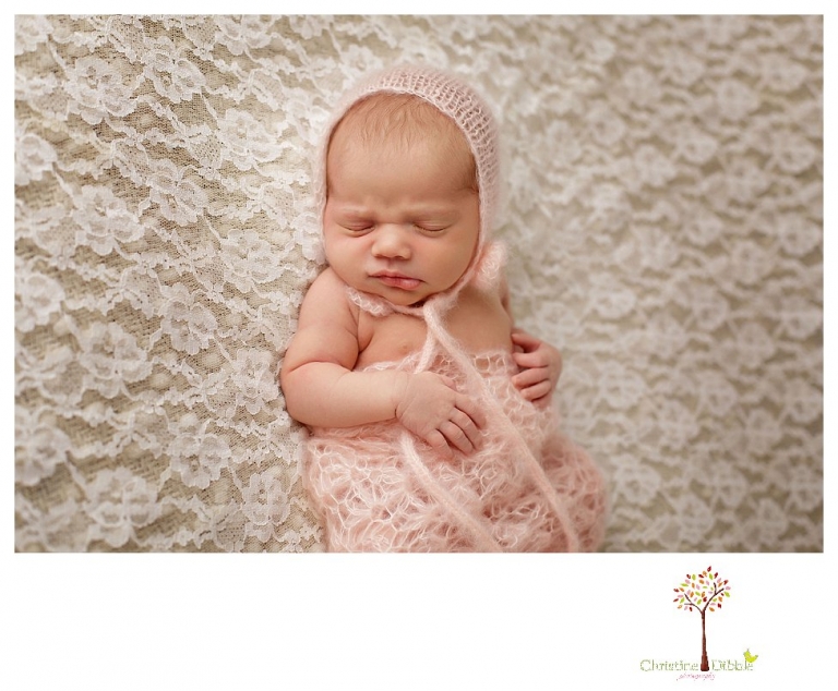 Best Sonora Newborn Photographer Christine Dibble Photography takes portraits of a sleeping newborn on blankets, in wraps and props, and on her mother's wedding dress.