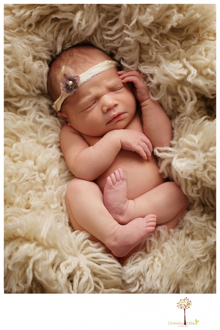 Best Sonora Newborn Photographer Christine Dibble Photography takes portraits of a sleeping newborn on blankets, in wraps and props, and on her mother's wedding dress.