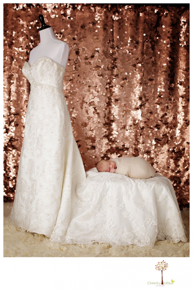 Best Sonora Newborn Photographer Christine Dibble Photography takes portraits of a sleeping newborn on blankets, in wraps and props, and on her mother's wedding dress.