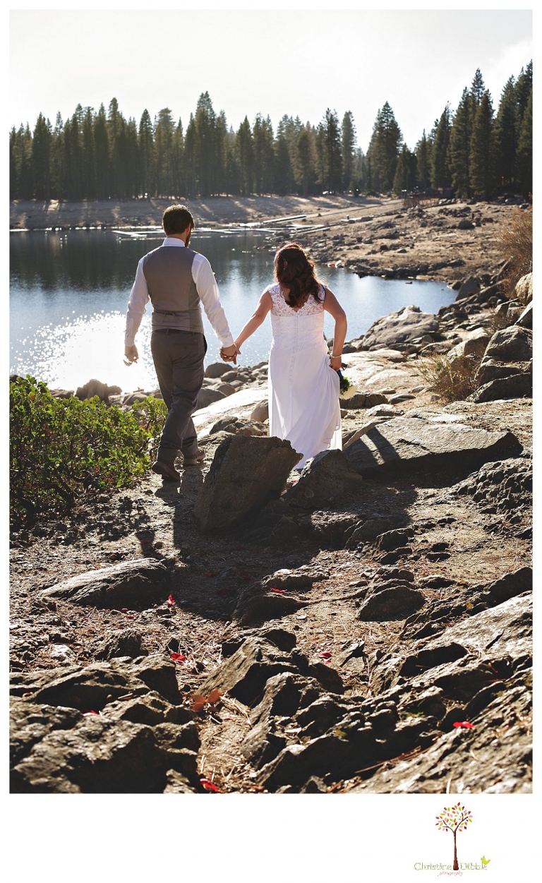 Sonora and Pinecrest wedding photographer Christine Dibble Photography takes wedding photos at a Pinecrest elopement including the couple walking on the beach.