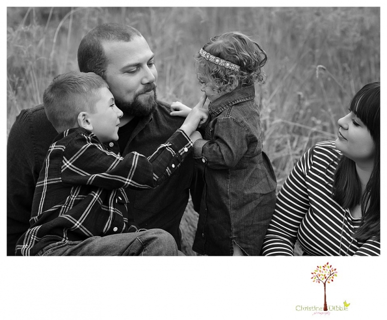 Sonora family photographer Christine Dibble Photography takes family portraits at Pinecrest Lake as the family plays in a field and then wears ugly sweaters for Christmas card photos.