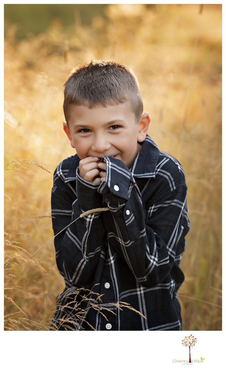 Sonora family photographer Christine Dibble Photography takes family portraits at Pinecrest Lake as the family plays in a field and then wears ugly sweaters for Christmas card photos.