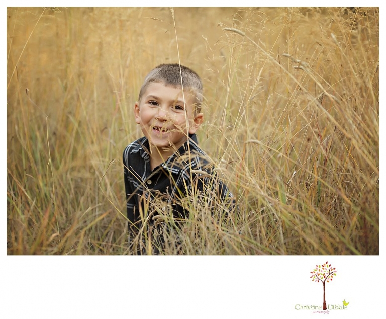 Sonora family photographer Christine Dibble Photography takes family portraits at Pinecrest Lake as the family plays in a field and then wears ugly sweaters for Christmas card photos.