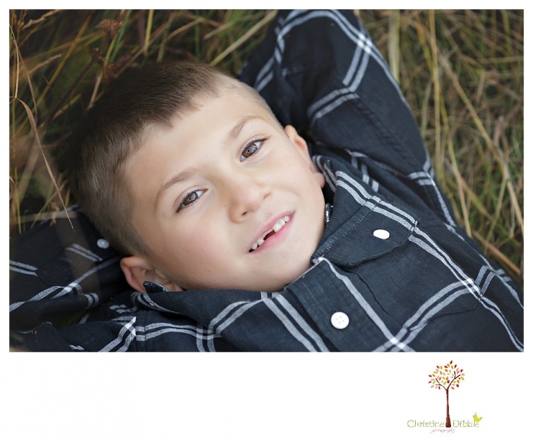 Sonora family photographer Christine Dibble Photography takes family portraits at Pinecrest Lake as the family plays in a field and then wears ugly sweaters for Christmas card photos.