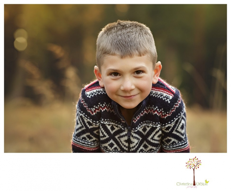 Sonora family photographer Christine Dibble Photography takes family portraits at Pinecrest Lake as the family plays in a field and then wears ugly sweaters for Christmas card photos.