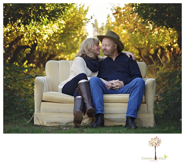Sonora Family Photographer Christine Dibble Photography takes extended Fall family photos at Indigeny Reserve on a cream velvet loveseat sitting in the apple orchard.