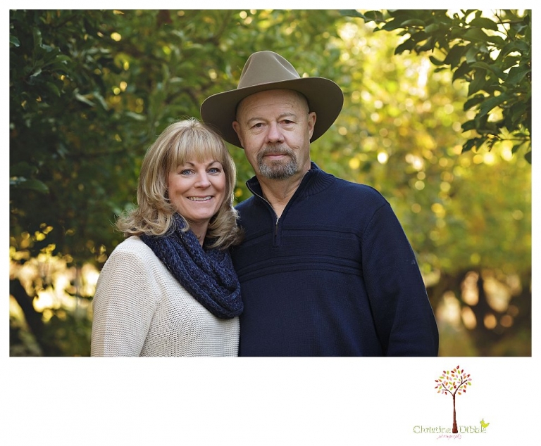 Sonora Family Photographer Christine Dibble Photography takes extended Fall family photos at Indigeny Reserve on a cream velvet loveseat sitting in the apple orchard.