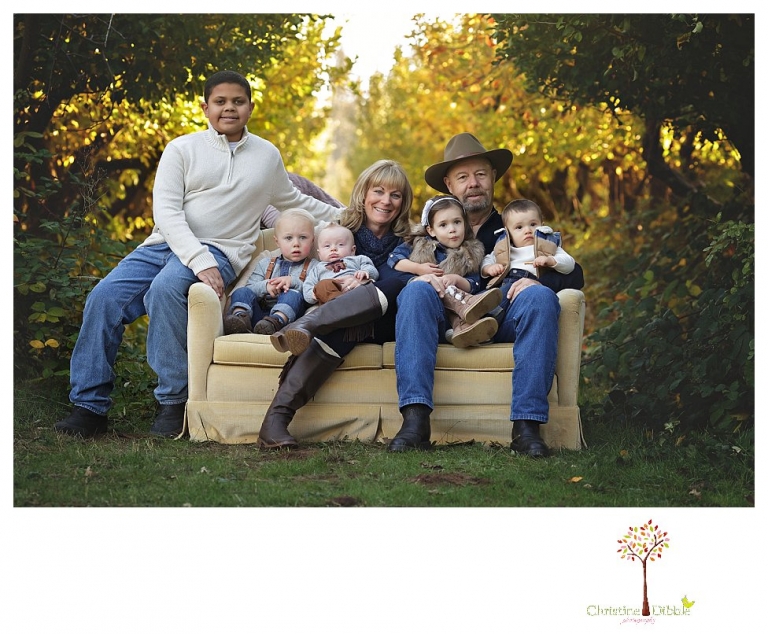 Sonora Family Photographer Christine Dibble Photography takes extended Fall family photos at Indigeny Reserve on a cream velvet loveseat sitting in the apple orchard.