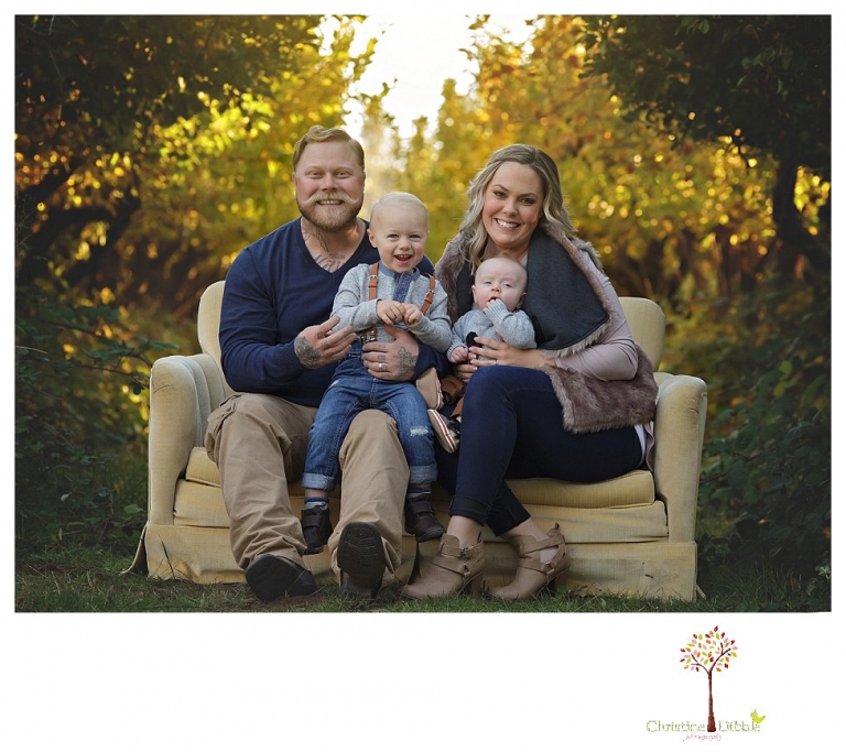 Sonora Family Photographer Christine Dibble Photography takes extended Fall family photos at Indigeny Reserve on a cream velvet loveseat sitting in the apple orchard.