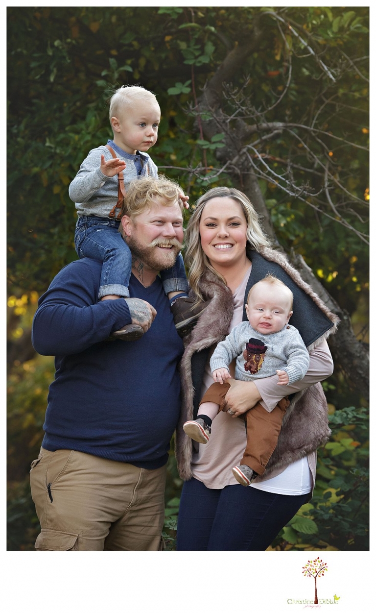 Sonora Family Photographer Christine Dibble Photography takes extended Fall family photos at Indigeny Reserve on a cream velvet loveseat sitting in the apple orchard.
