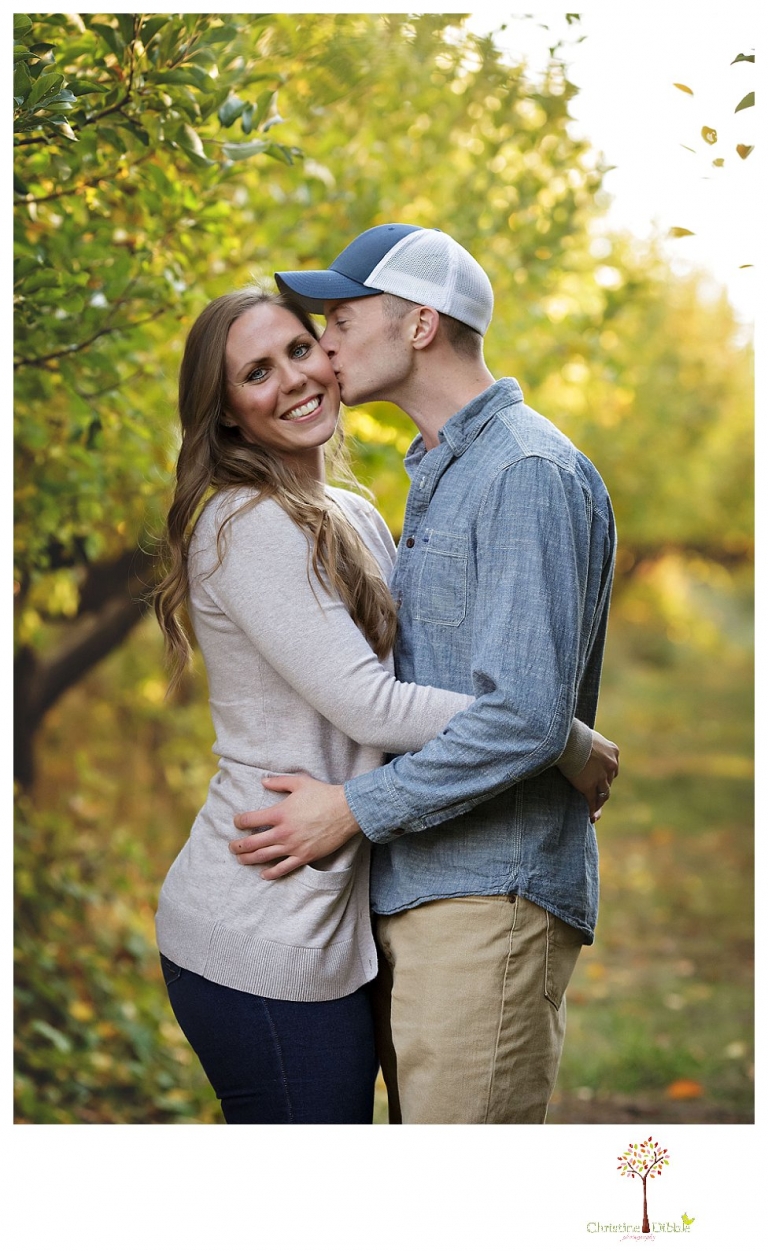 Sonora Family Photographer Christine Dibble Photography takes extended Fall family photos at Indigeny Reserve on a cream velvet loveseat sitting in the apple orchard.