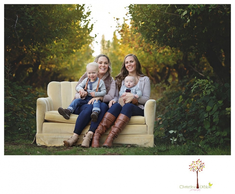Sonora Family Photographer Christine Dibble Photography takes extended Fall family photos at Indigeny Reserve on a cream velvet loveseat sitting in the apple orchard.