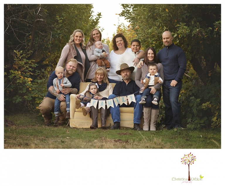 Sonora Family Photographer Christine Dibble Photography takes extended Fall family photos at Indigeny Reserve on a cream velvet loveseat sitting in the apple orchard.